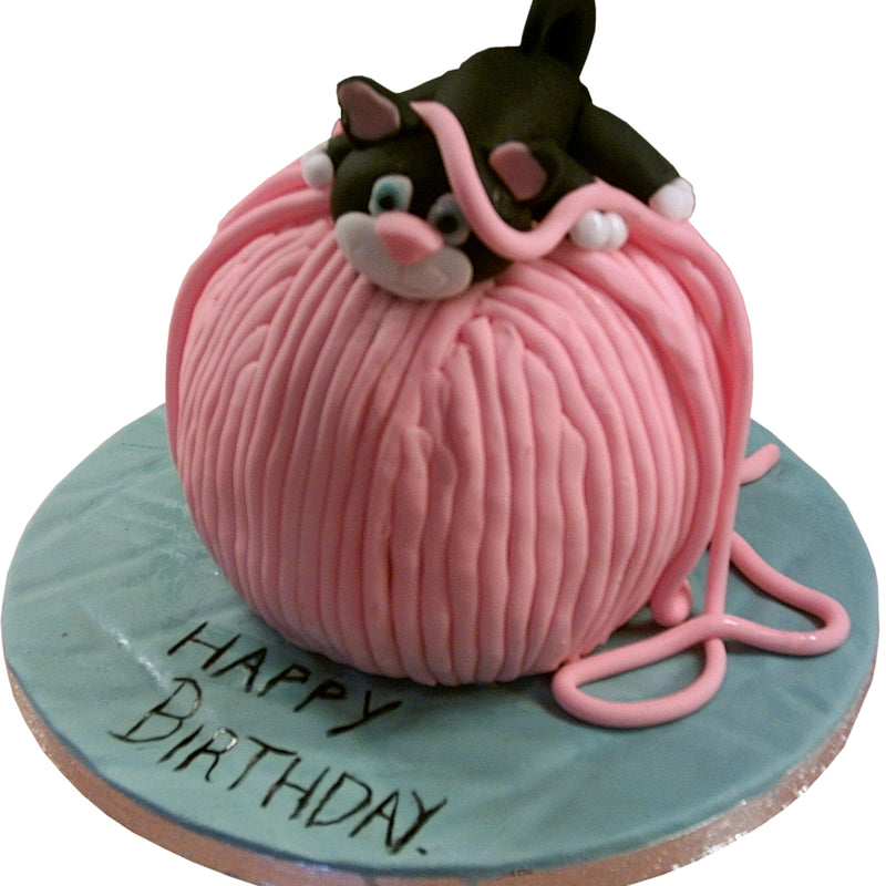 Kitten Playing Birthday Cake